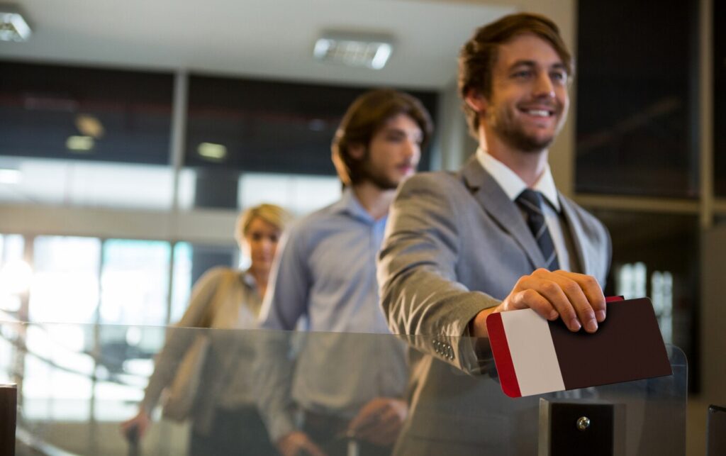 businessman with boarding pass check counter