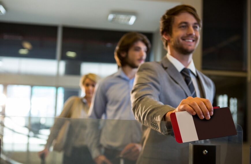 businessman with boarding pass check counter