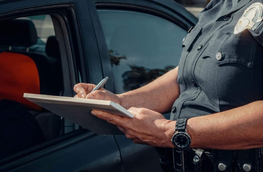 Police Writing on a Notebook